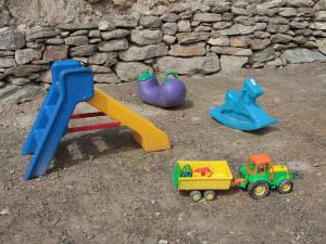 a group of plastic toys sitting on the ground at B&B Alba Sul Lago in Pergine Valsugana