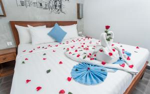 מיטה או מיטות בחדר ב-Home Chic Hotel