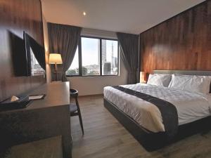 a hotel room with a bed and a desk at Frame Hotel in George Town +60 photos