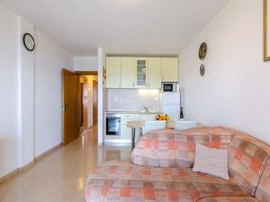 a living room with a couch and a kitchen at Apartment Nenad in Dramalj