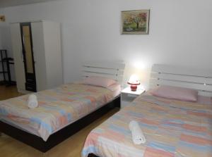 Postel nebo postele na pokoji v ubytování MT-Room