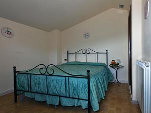 En eller flere senge i et værelse på B&B Colle San Francesco