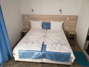 Postel nebo postele na pokoji v ubytování Guest House Evtimov