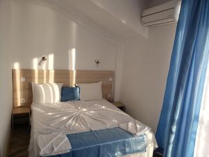Postel nebo postele na pokoji v ubytování Guest House Evtimov