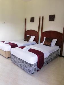 Postel nebo postele na pokoji v ubytování AsiaCamp Taman Negara Resort