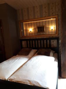 Postel nebo postele na pokoji v ubytování Old West Ranch "Urlaub auch mit Pferd möglich"