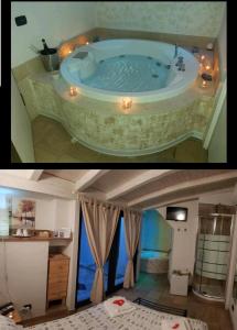 a bath tub in a room with a bedroom at Il Daviduccio in Catania