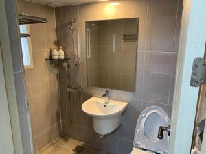 a bathroom with a sink and a mirror at Gyeongju Roamers Stay in Gyeongju +15 photos