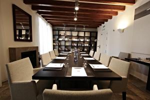 a large dining room with a long table and chairs at Petit Palace Hotel Tres in Palma de Mallorca +55 photos