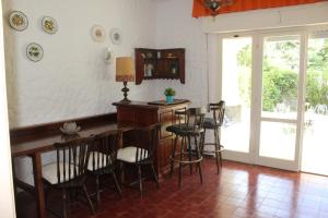 a room with a bar with chairs and a table at VILLA CARLA in Numana