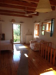 a living room with a couch and a window at The "M" House in Gaios