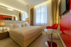 Posteľ alebo postele v izbe v ubytovaní Salvator Boutique Hotel vegan-friendly