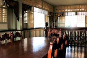 a conference room with a wooden table and chairs at Las Casas Filipinas de Acuzar in Bagac +93 photos
