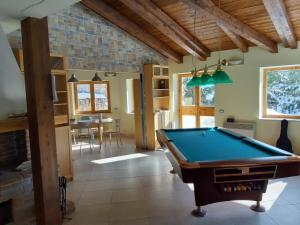 a room with a pool table in a house at Villa Russo in Castel di Sangro