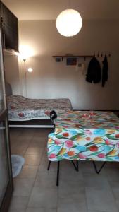 Giường trong phòng chung tại Appartamento Picasso