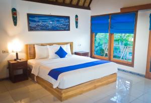 Postel nebo postele na pokoji v ubytování Blue Monkey Retreat Areguling Lombok
