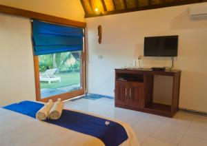 Postel nebo postele na pokoji v ubytování Blue Monkey Retreat Areguling Lombok