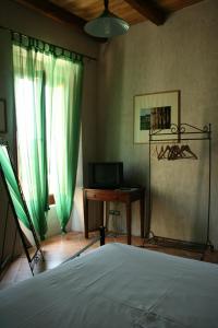 Katil atau katil-katil dalam bilik di Rosacanina B&B