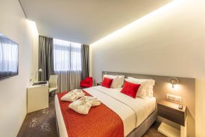 Postel nebo postele na pokoji v ubytování Meliá Maputo Sky + 36 fotografií
