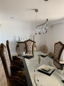 a dining room with a table and chairs at Villa GAULTHIER in Marbella