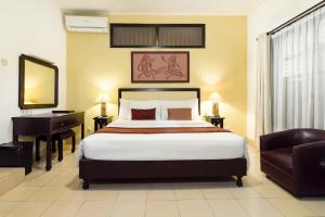 Llit o llits en una habitació de Sarinande Hotel
