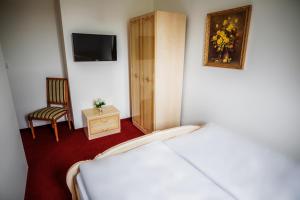 Postel nebo postele na pokoji v ubytování Hotel Dejmalik