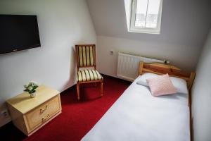 Postel nebo postele na pokoji v ubytování Hotel Dejmalik