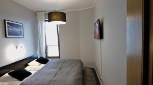 Posteľ alebo postele v izbe v ubytovaní APARTAMENT z 3 SYPIALNIAMI PRZY PLAŻY