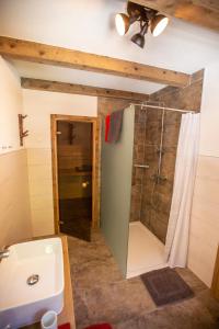 a bathroom with a shower and a sink at Ferienwohnung Heimatglück in Matrei in Osttirol