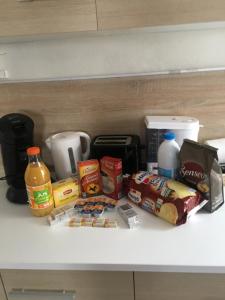 a shelf with various food items on it at Melitine in Saint-Amand-Montrond