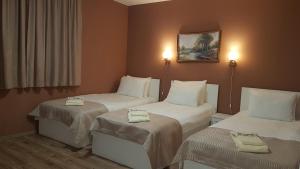 Postel nebo postele na pokoji v ubytování MARIANA - guest rooms