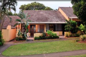 a house in the suburbs of australia at Manzini Chalets in St Lucia