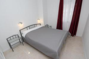 Łóżko lub łóżka w pokoju w obiekcie Apartments Palaziol