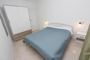 Łóżko lub łóżka w pokoju w obiekcie Apartments Palaziol
