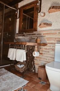 a bathroom with a sink and a toilet at Antiguo Rincón in Colungo +20 photos