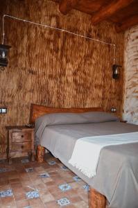 Un pat sau paturi într-o cameră la Antiguo Rincón