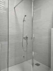a shower with a glass door in a bathroom at Green Side in Kotor +25 photos