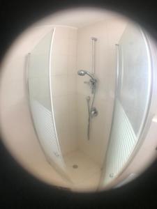 a view of a shower in a bathroom at Magnificant Studio/Zimmer Zichron in Zikhron Ya'akov