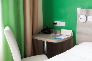 Postel nebo postele na pokoji v ubytování Raziotel Kyiv Yamska