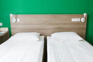 Postel nebo postele na pokoji v ubytování Raziotel Kyiv Yamska