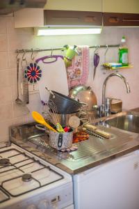 A kitchen or kitchenette at Little Arco Guest House