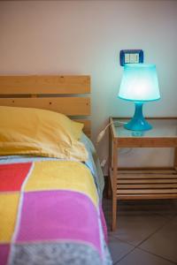 A bed or beds in a room at Little Arco Guest House