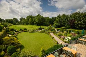 an aerial view of a garden with a large lawn at Hotel Bemelmans in Schin op Geul