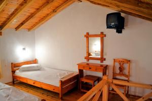 Postel nebo postele na pokoji v ubytování Aiolos House