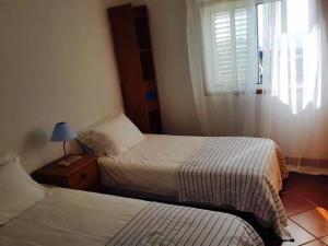 Letto o letti in una camera di BEACH-SURF house