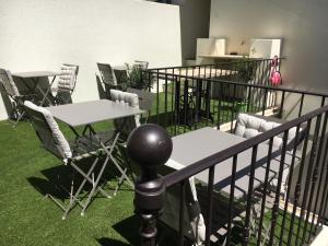 a group of tables and chairs in a room at Ô 36 Rempart Sud B&B in Aigues-Mortes