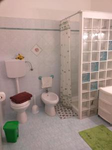 a toy bathroom with a toilet and a shower at B&B Il Girasole in Balestrate +14 photos