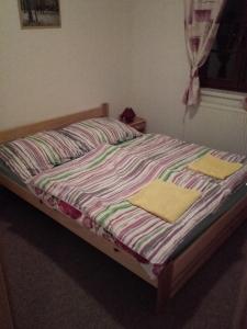 a bed in a bedroom with two towels on it at Pavlov Děvicky in Pavlov