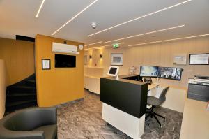 an office cubicle with a desk and a chair at Cityview Hotel in Amsterdam