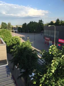 a view of a parking lot from a building at City center apartments in Panevėžys